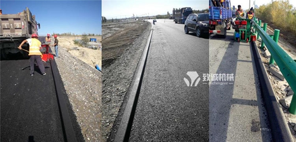 瀝青砂攔水帶滑模機(jī)施工現(xiàn)場